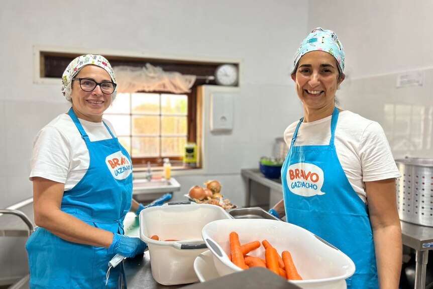 Two women in brightly lit commercial kitchen