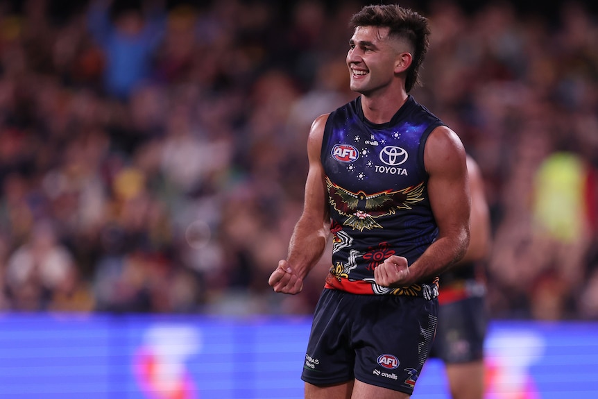 Josh Rachele celebrates an Adelaide Crows AFL goal.