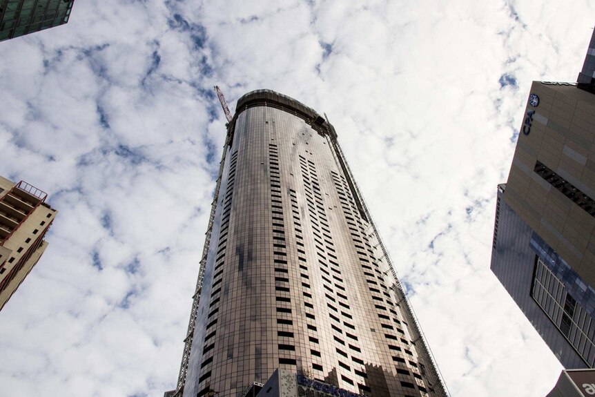 A tall apartment building under construction