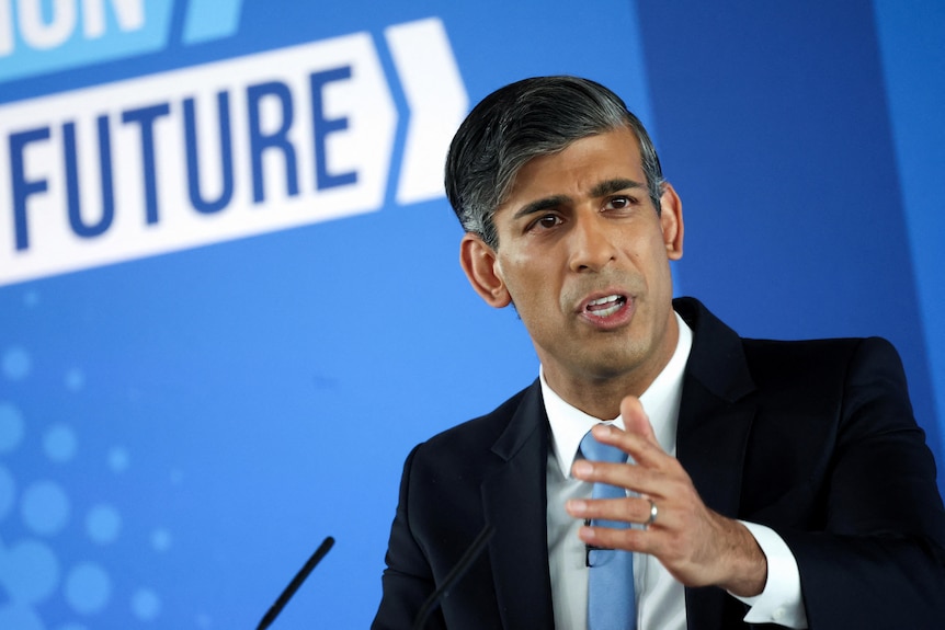 A close up of Rishi Sunak making a speech and gesturing with his left hand