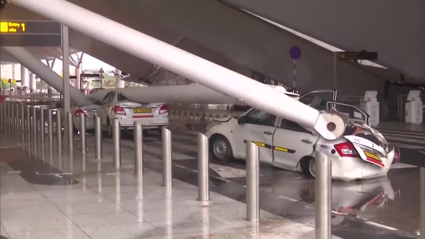 A car crushed by a fallen roof. 