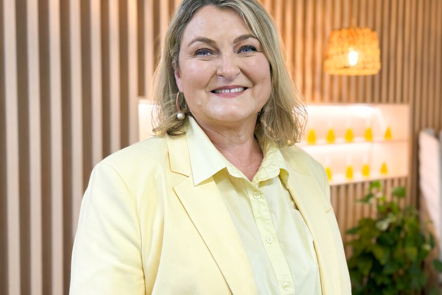 woman in yellow blazer