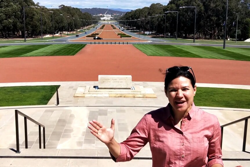 Kira Korolev stands outside the war memorial in Canberra