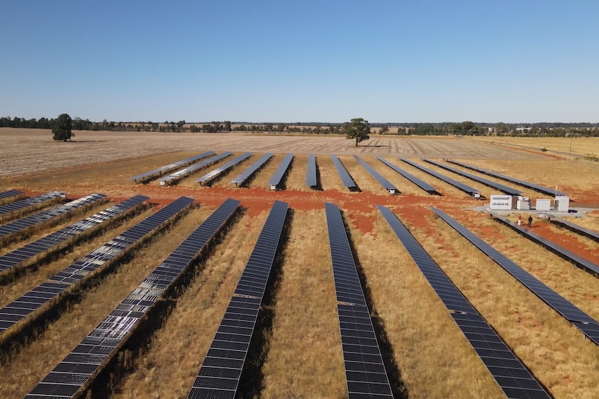 Arrays of solar panels on a rural property.