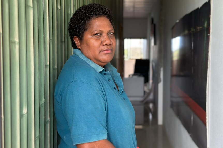 A solomon islander looking back at the camera with a pensive expression 