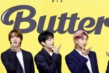 BTS members V, Suga, Jin, Jungkook, RM, Jimin and J-Hope promote the single Butter.