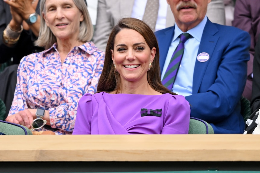 Princess Catherine smiles courtside at Wimbledon in a purple dress