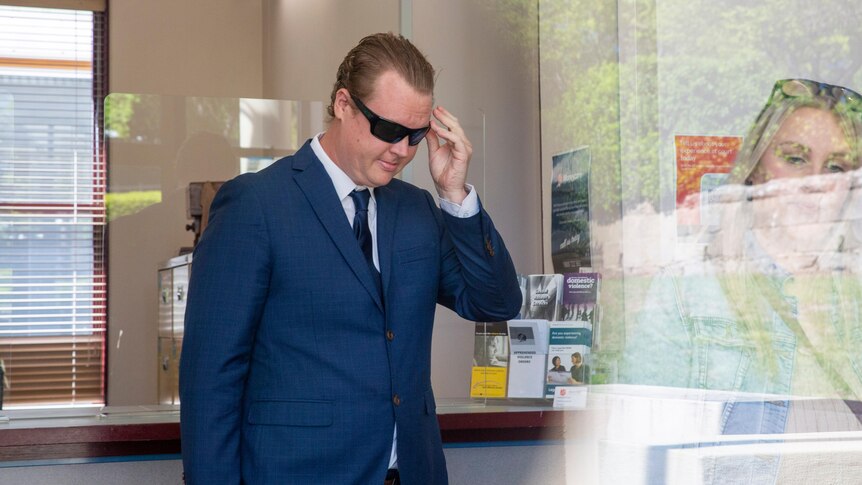 man wearing sunglasses in court