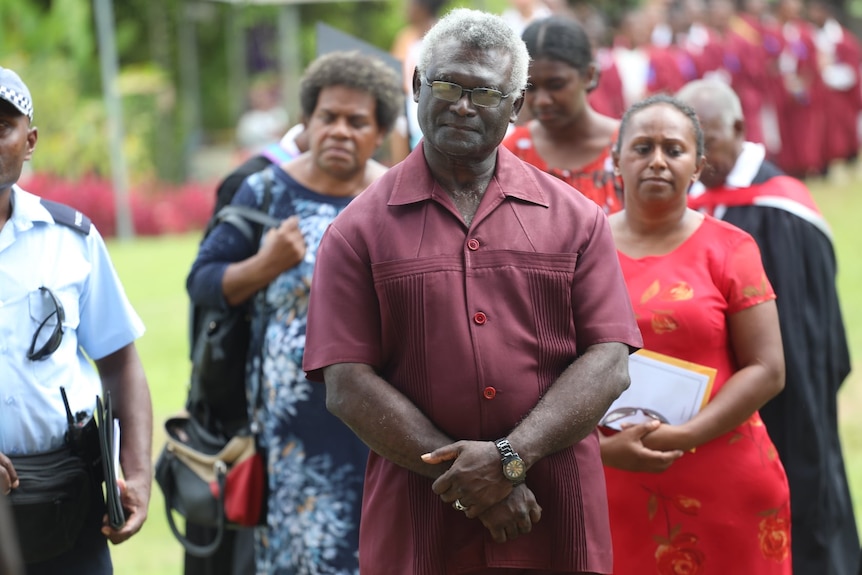  Manasseh Sogavare standing at an event outside.