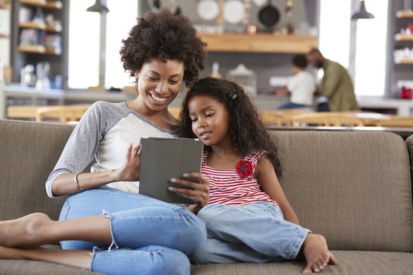 A mother is shown, talking with her daughter.