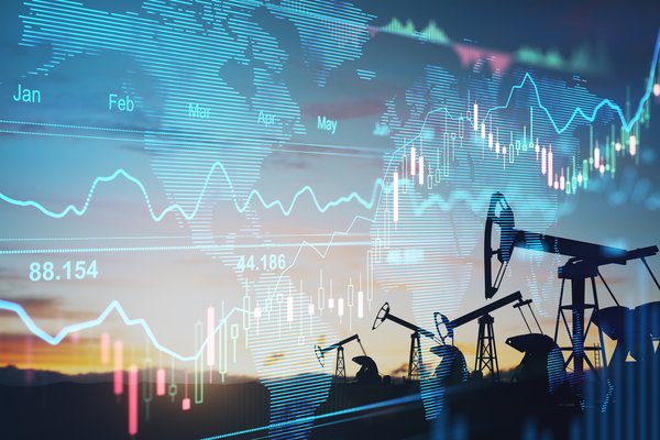 Oil pumps with a price chart in the background.