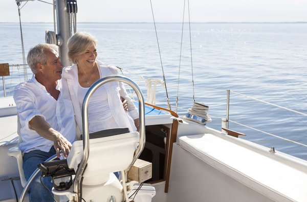 Two people on a sailboat.