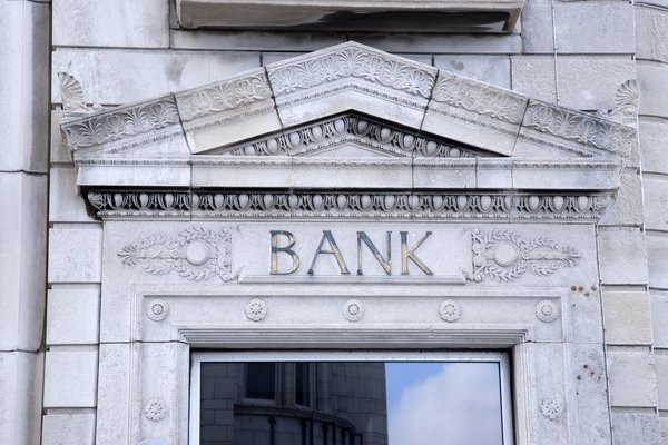 Front entrance of a stone bank building.