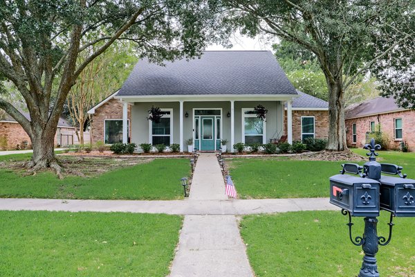 Pretty single-family house with a turquoise door.