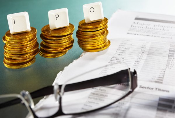 Stacked coins with blocks on them spelling IPO