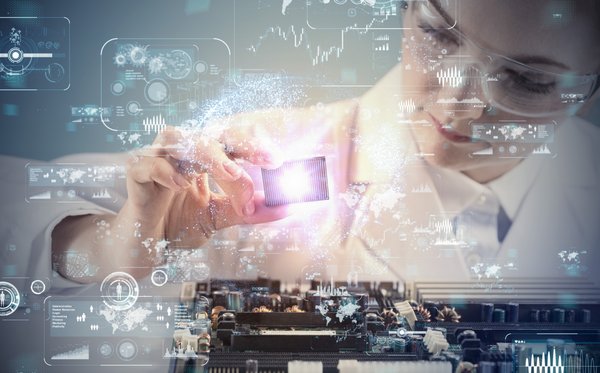 Woman holding microchip electronic technology.