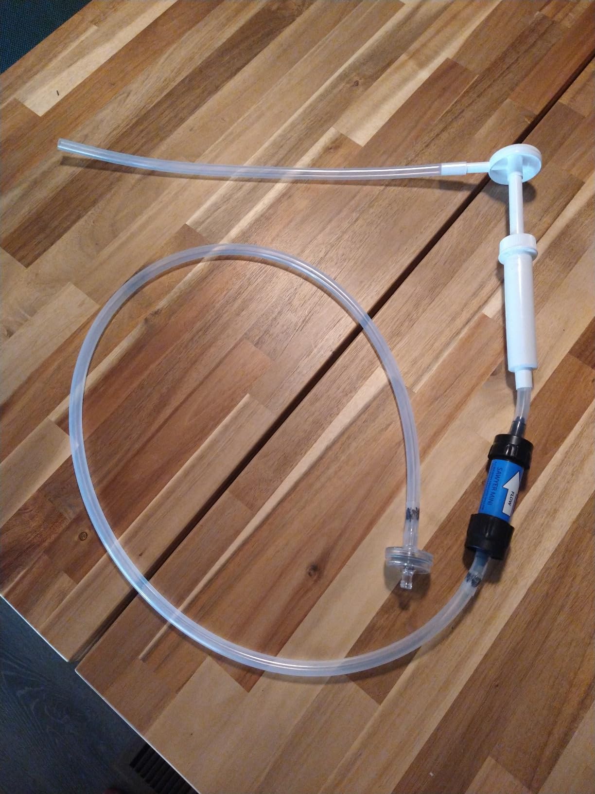 Filter works great, but the squeeze system is for the birds. I built a lightweight DIY pump.