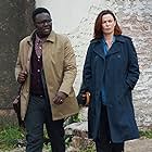 Eve Myles and Babou Ceesay in We Hunt Together (2020)