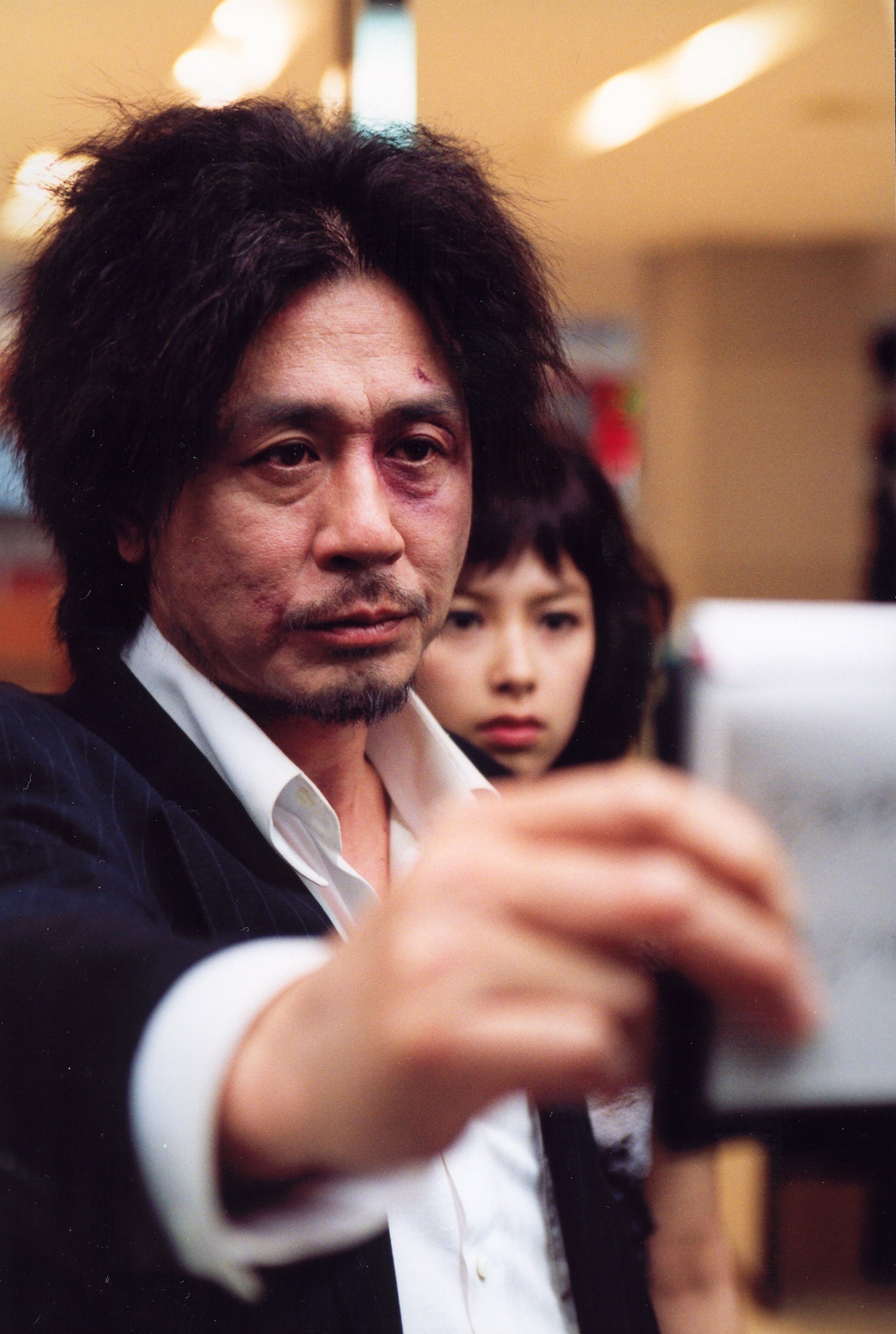 Choi Min-sik and Kang Hye-jeong in Oldboy (2003)