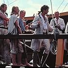 Mel Gibson, Anthony Hopkins, Liam Neeson, Dexter Fletcher, and Phil Davis in The Bounty (1984)