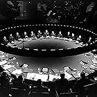 Peter Sellers, George C. Scott, Peter Evans, Robert O'Neil, Jeff Silk, Roy Stephens, Gordon Tanner, Reg Thomason, Peter Roy, Victor Harrington, Joe Phelps, and George Holdcroft in Dr. Strangelove or: How I Learned to Stop Worrying and Love the Bomb (1964)