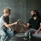 Oscar Isaac and Domhnall Gleeson in Ex Machina (2014)