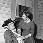 Don Collier and Judy Lewis in Outlaws (1960)