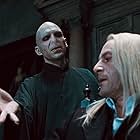 Ralph Fiennes, Jason Isaacs, and Tom Felton in Harry Potter and the Deathly Hallows: Part 1 (2010)