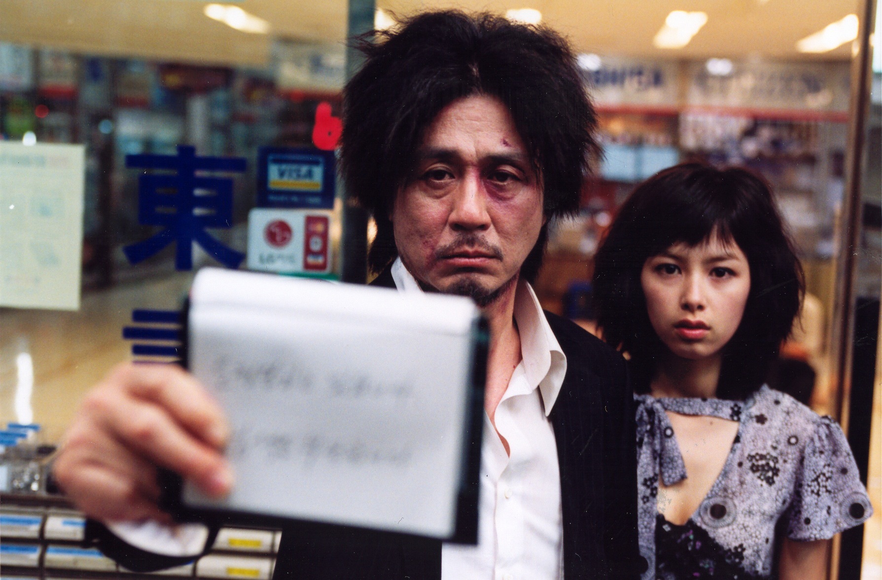 Choi Min-sik and Kang Hye-jeong in Oldboy (2003)