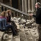 Rupert Grint, Emma Watson, and David Yates in Harry Potter and the Deathly Hallows: Part 2 (2011)