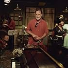 Director/producer/story writer TAYLOR HACKFORD (center), JAMIE FOXX as American legend Ray Charles (left foreground) and REGINA KING as Margie Hendricks (far right) on the set of the musical  biographical drama, Ray.