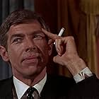 James Coburn in Dead Heat on a Merry-Go-Round (1966)