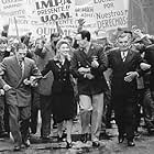 From poor beginnings Eva (Madonna, center left) marries rising political star Juan Peron (Jonathan Pryce, center right) and becomes the most powerful woman in the country.