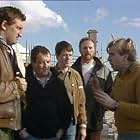 Timothy Spall, Tim Healy, Jimmy Nail, Pat Roach, and Kevin Whately in Auf Wiedersehen, Pet (1983)