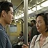 Teo Yoo and Greta Lee in Past Lives (2023)