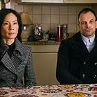 Jonny Lee Miller and Lucy Liu in Elementary (2012)