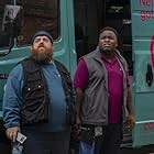 Nick Frost and Samson Kayo in The Watcher on the Water (2020)