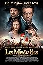 Russell Crowe, Anne Hathaway, Sacha Baron Cohen, Hugh Jackman, Amanda Seyfried, and Eddie Redmayne in Les Misérables (2012)