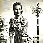 Joan Taylor appeared in 18 episodes of THE RIFLEMAN playing Milly Scott, Owner of the General Store bought from Hattie Denton.