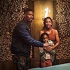 Jamie Foxx, Meagan Good, and Zion in Day Shift (2022)