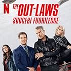 Pierce Brosnan, Ellen Barkin, Nina Dobrev, and Adam Devine in The Out-Laws (2023)