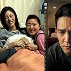 John Cho, Sara Sohn, and Michelle La in Searching (2018)