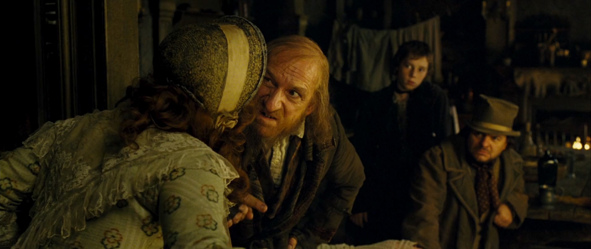 Ben Kingsley, Jamie Foreman, Leanne Rowe, and Lewis Chase in Oliver Twist (2005)