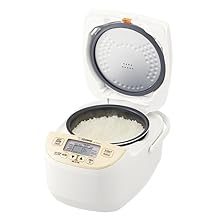 open rice cooker with delicious rice inside