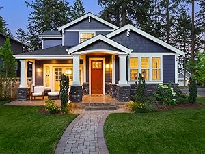 Photo shows a well-lit home in the evening