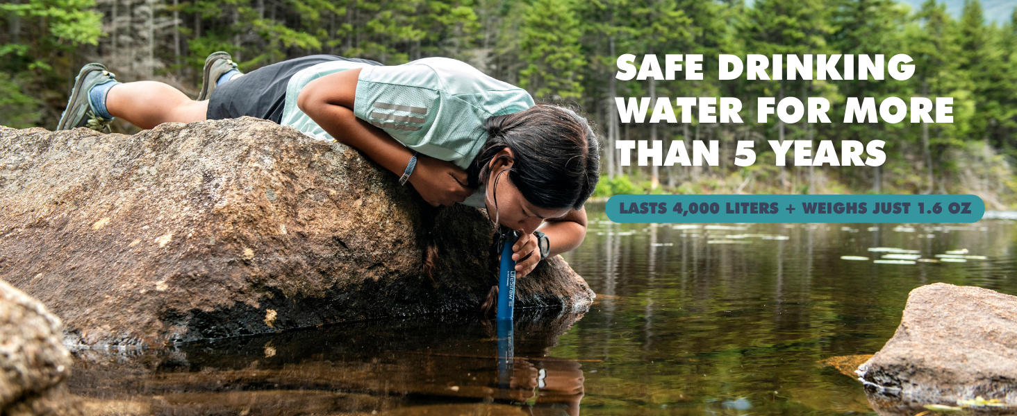 Person drinking from stream from LifeStraw