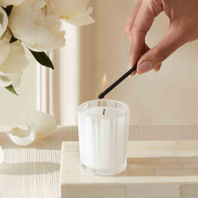 NEST Votive Candle being lit