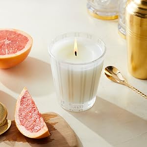 Classic Candle surrounded by sliced grapefruit