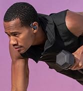 Model wearing sport wireless workout earbuds on a solid purple background