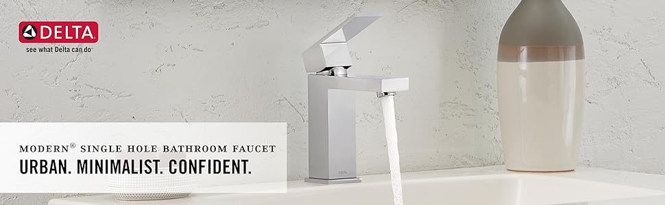 In-context image of a bathroom faucet with water on installed onto a vanity